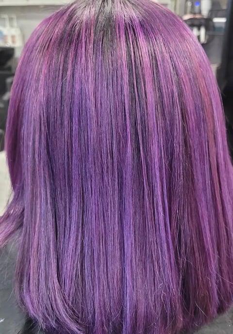 Back view of long purple hair with straight layers